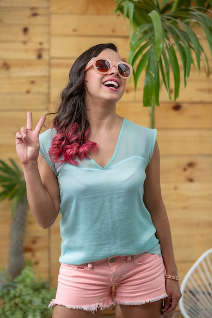 Mexican young woman wearing sunglasses summer portrait