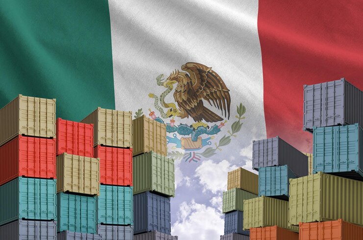 Mexico flag and big stack of shipping cargo containers in docks with sky background
