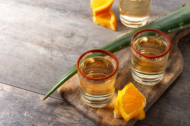 Mezcal Mexican drink with orange slices and worm salt