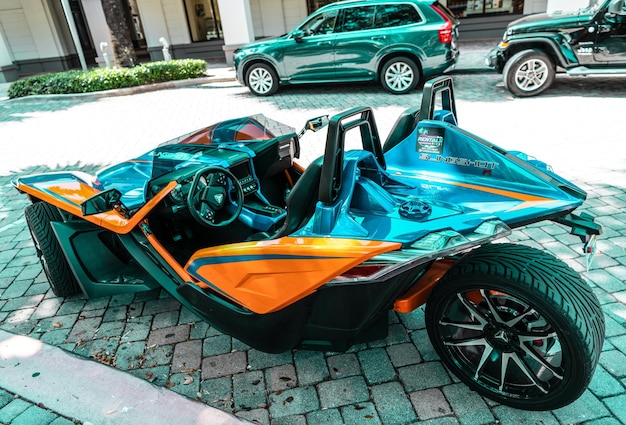 Miami Beach Florida USA April 15 2021 blue orange polaris slingshot back corner view