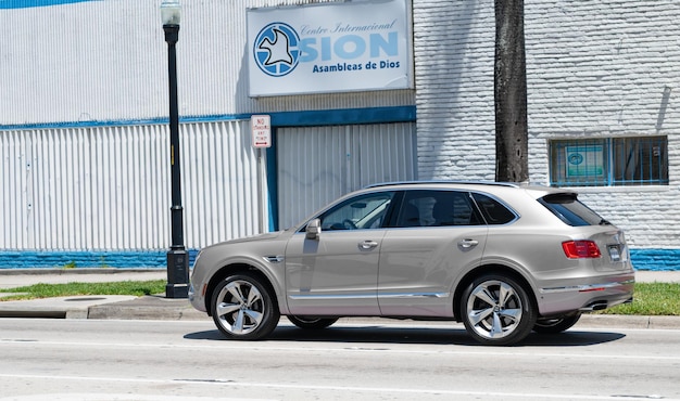 Miami Beach Florida USA April 15 2021 silver Bentley Bentayga v8 2015 suv back side view