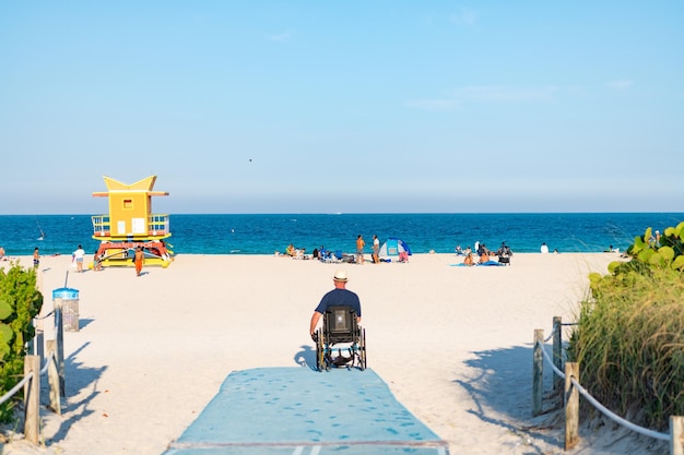 Miami beach florida usa april 19 2021 lifeguard tower in summer\
beach with man rescuer