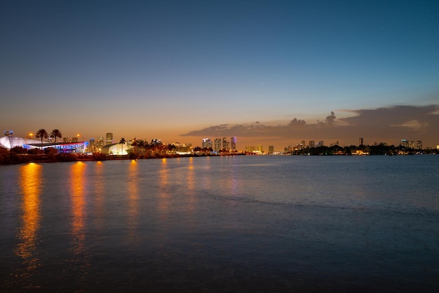 Miami city miami skyline panorama at dusk with skyscrapers over sea night downtown sanset