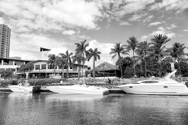 Miami florida usa february 19 2016 different yachts in miami\
marina bay at south beach on water in bay at sunny day with clouds\
on blue sky