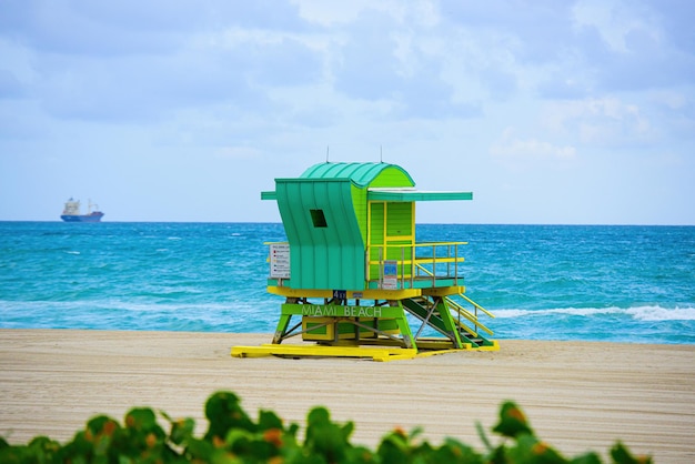 Miami south beach lifeguard tower and coastline with cloud and blue sky