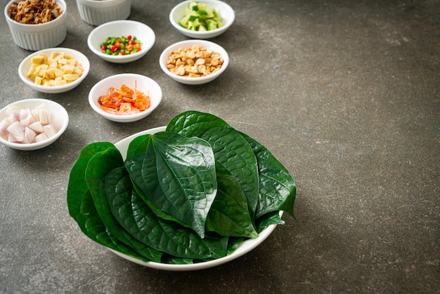 Miang kham - A royal leaf wrap appetizer - It is a traditional Southeast Asian snack from Thailand and Laos.