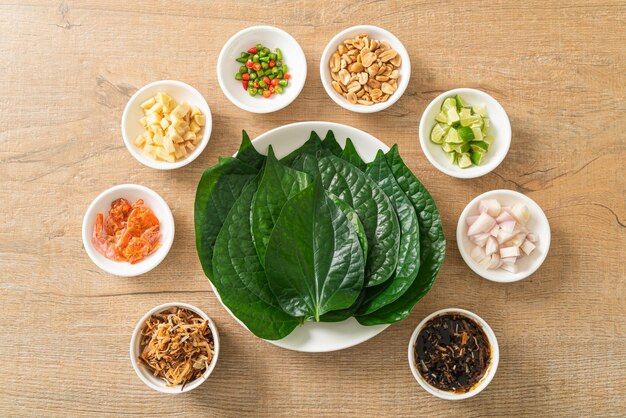 miang kham - a royal leaf wrap appetizer - it is a traditional southeast asian snack from thailand and laos.