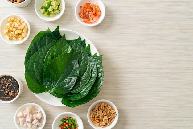miang kham - a royal leaf wrap appetizer - it is a traditional southeast asian snack from thailand and laos.