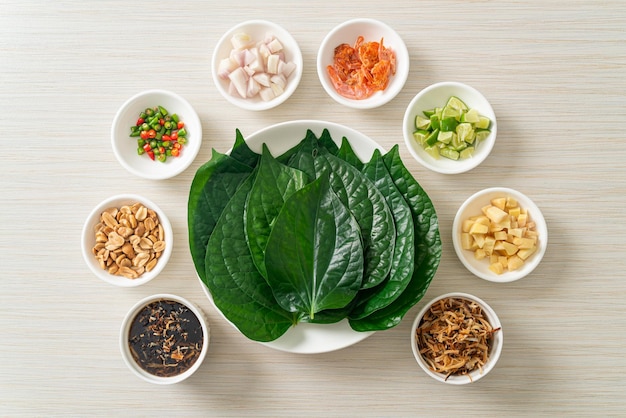 miang kham - a royal leaf wrap appetizer - it is a traditional southeast asian snack from thailand and laos.
