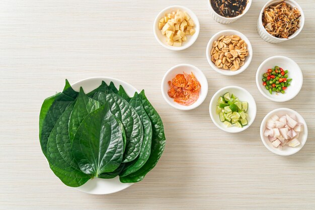 miang kham a royal leaf wrap appetizer it is a traditional southeast asian snack from thailand and laos