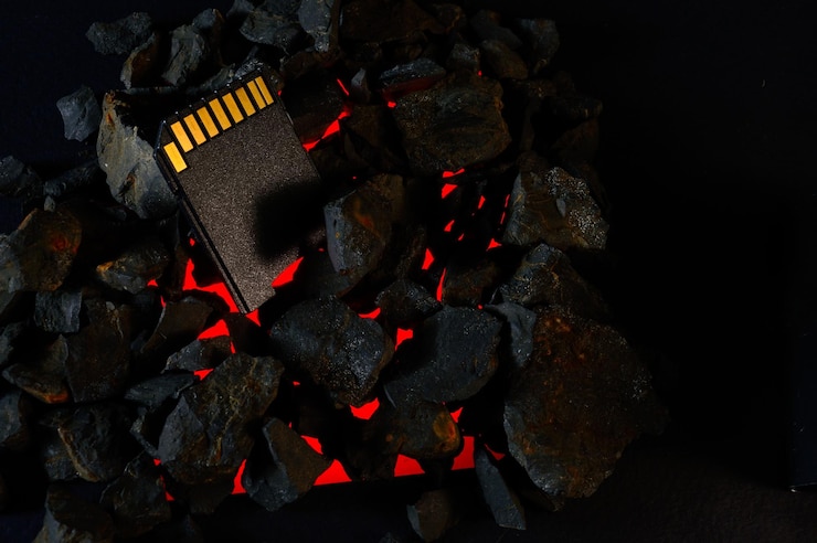 Photo the micro sd card lies on hot coals closeup