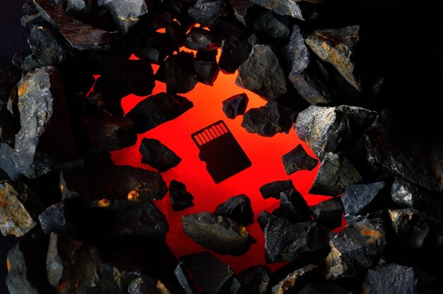 The micro sd card lies on hot coals Closeup