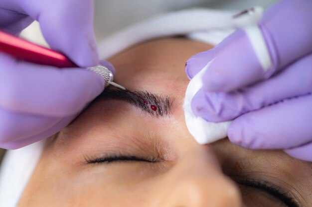 Photo microblading eyebrows semi-permanent makeup procedure
