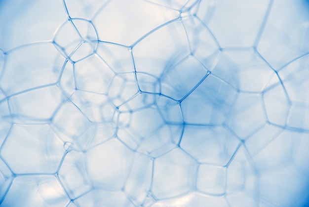 Micrograph of foamy chemical fluid. The chain of compounds of microparticles