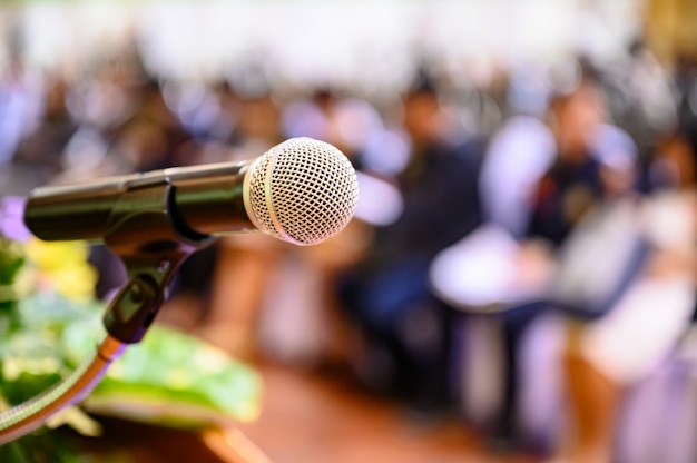 Microphone over the blurred business forum 