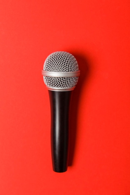 Microphone on a bright red background