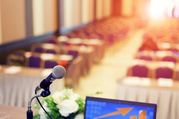 Microphone in the  conference hall or seminar room background.