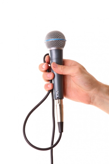 Photo microphone in male hand isolated on white