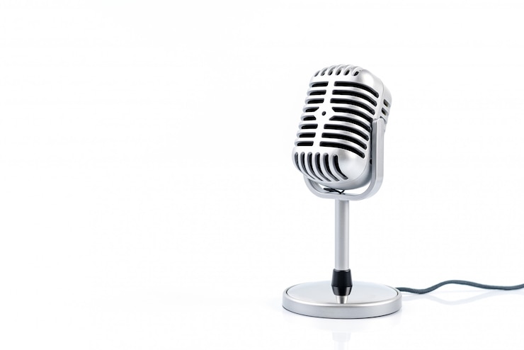 Photo microphone retro isolated on white wall.