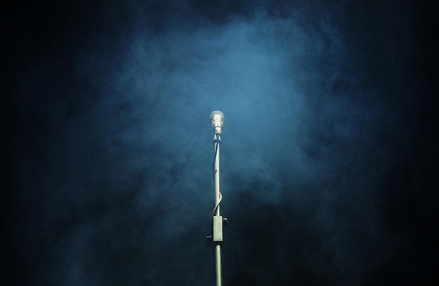 Microphone in a smoke on a dark background