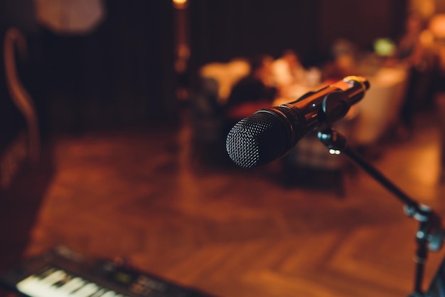 Photo microphone on stage against a background of auditorium