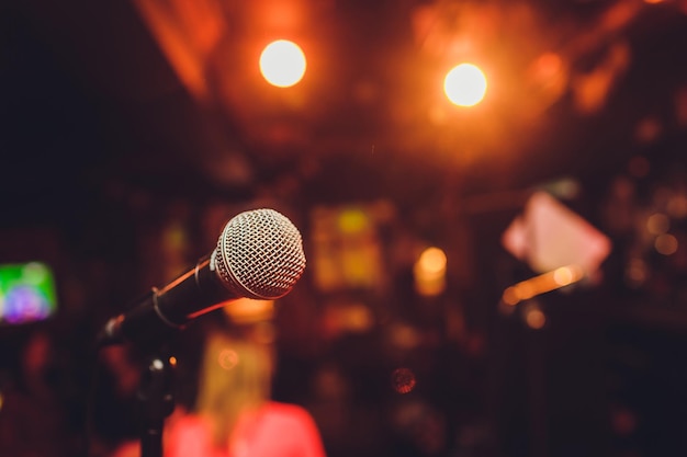 Microphone on stage against a background of auditorium