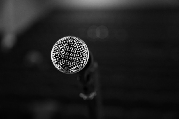 Microphone on stage on a blurry background from a close angle