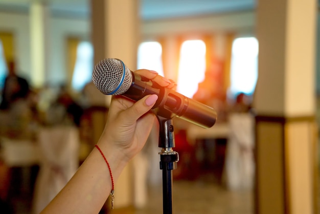 Microphone on stage. Microphone close-up. Microphone. A pub. Bar. A restaurant. Classical. Evening. Night show. Restaurant.