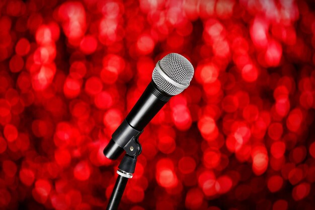 Microphone on stand on red background