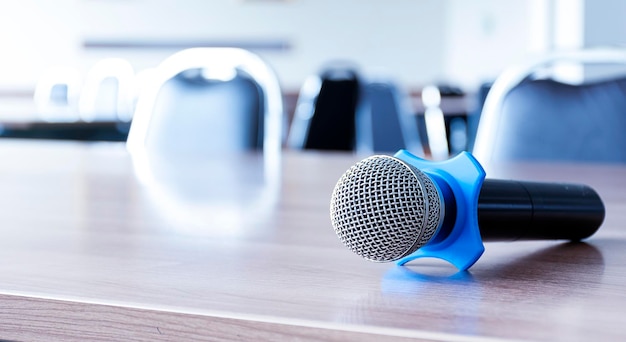 Microphone on table in seminar room and copy space