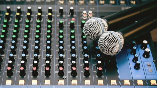 Microphone with sound mixer in studio workplace for live the media and sound recording.
