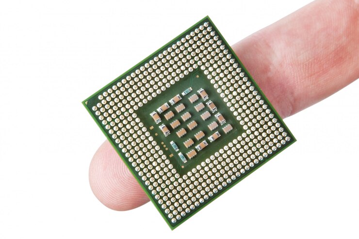 Photo microprocessor the finger. on a white wall.