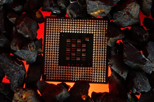 Photo the microprocessor from the computer lies on hot coals closeup