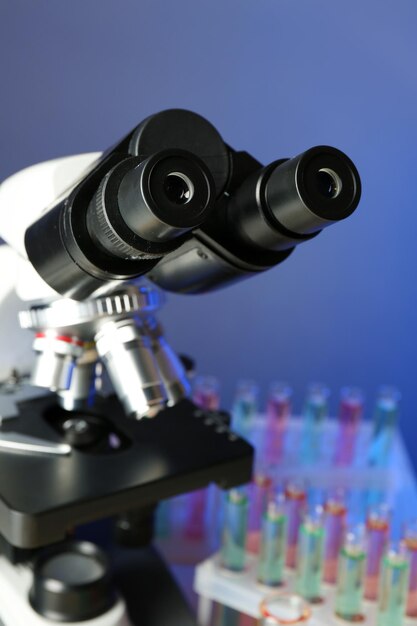 Microscope on color background closeup