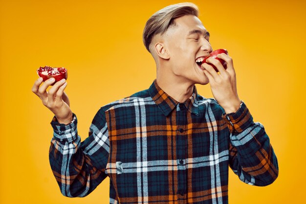 Mid adult man looking away against orange background