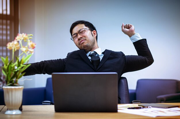 mid adult man using mobile phone at table