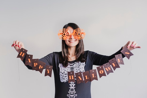 Photo mid adult woman holding halloween text against white background
