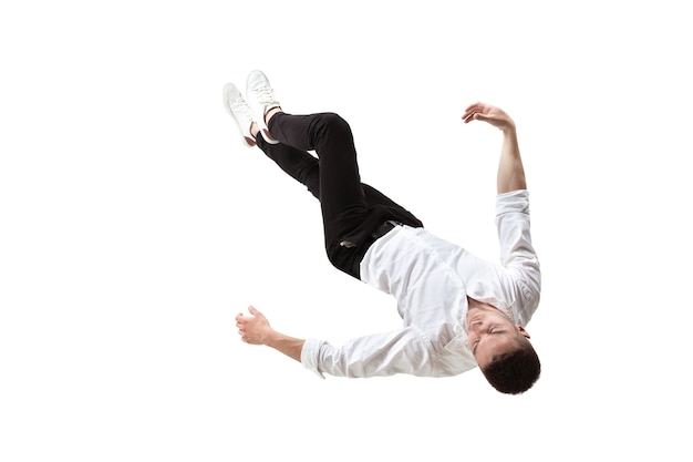 Mid-air beauty. Full length studio shot of attractive young man hovering in air and keeping eyes closed