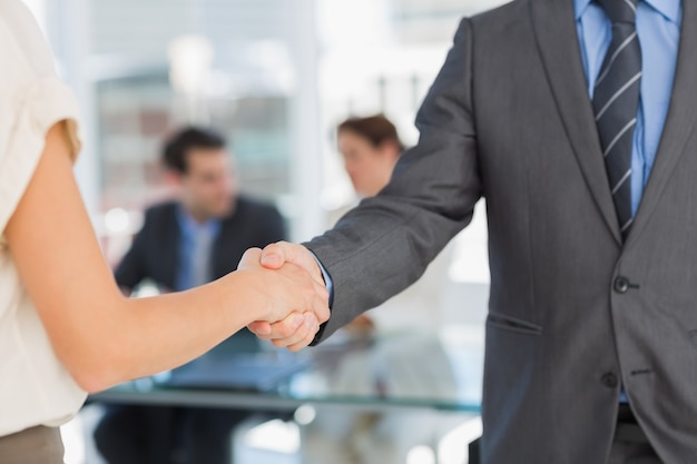 Mid section of handshake to seal a deal after meeting