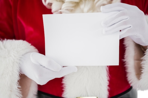 Mid section of santa holding card