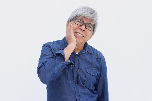 Middle age Asian senior man wearing casual clothes touching mouth with hand with painful expression