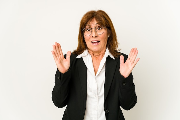 Middle age business woman isolated surprised and shocked