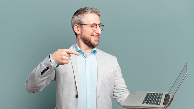 Middle age businessman with a laptop