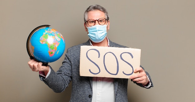 middle age businessman with a world globe map