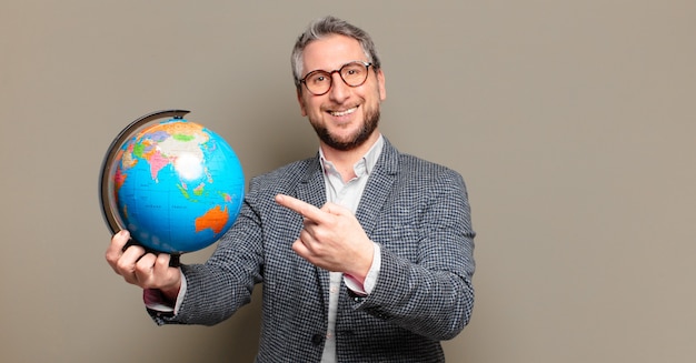 Middle age businessman with a world globe map