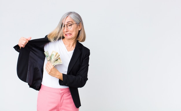 Middle age businesswoman with dollar bills