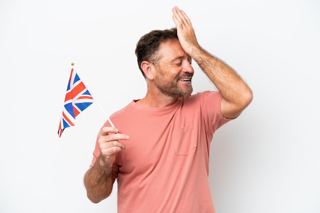 Middle age caucasian man holding English flag isolated on white background has realized something and intending the solution