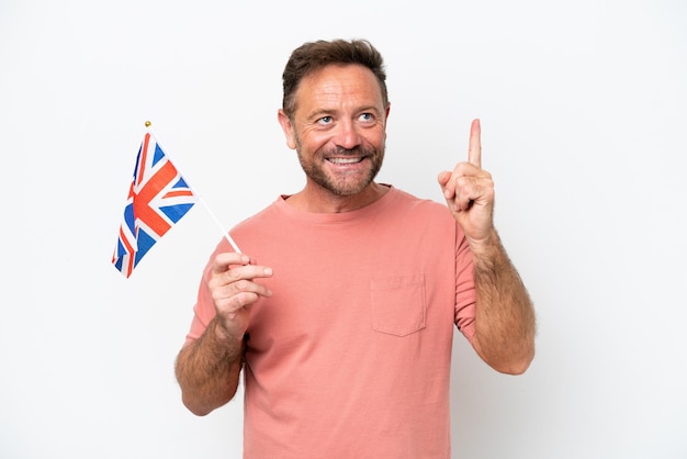 Middle age caucasian man holding English flag isolated on white background pointing up a great idea