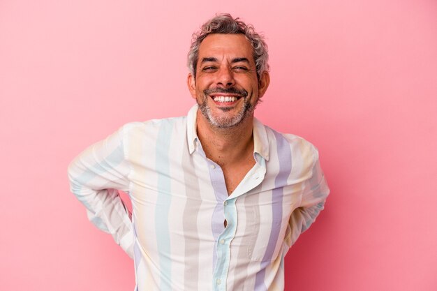 Middle age caucasian man isolated on pink background  happy, smiling and cheerful.