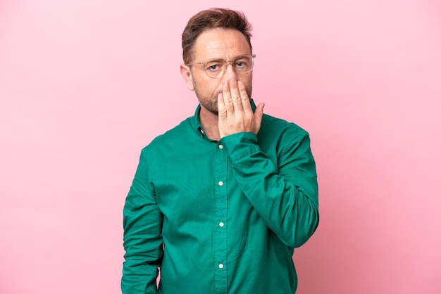 Middle age caucasian man isolated on pink background